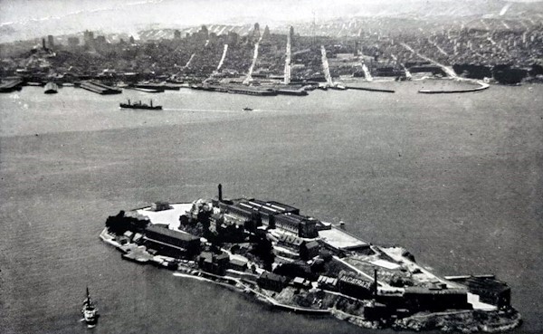 " Alcatraz aerial 1930s " by FoundSF, Modifications: Cropped and levels adjusted is licensed under CC BY-NC-SA 3.0
