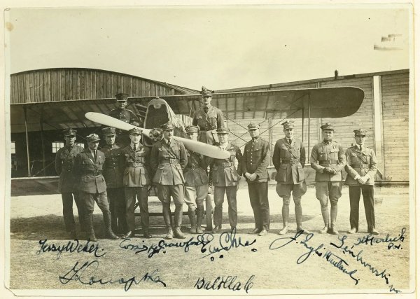 Original members of the Kosciuszko Squadron, Chess is the man whose face is partly hidden by the plane's propeller